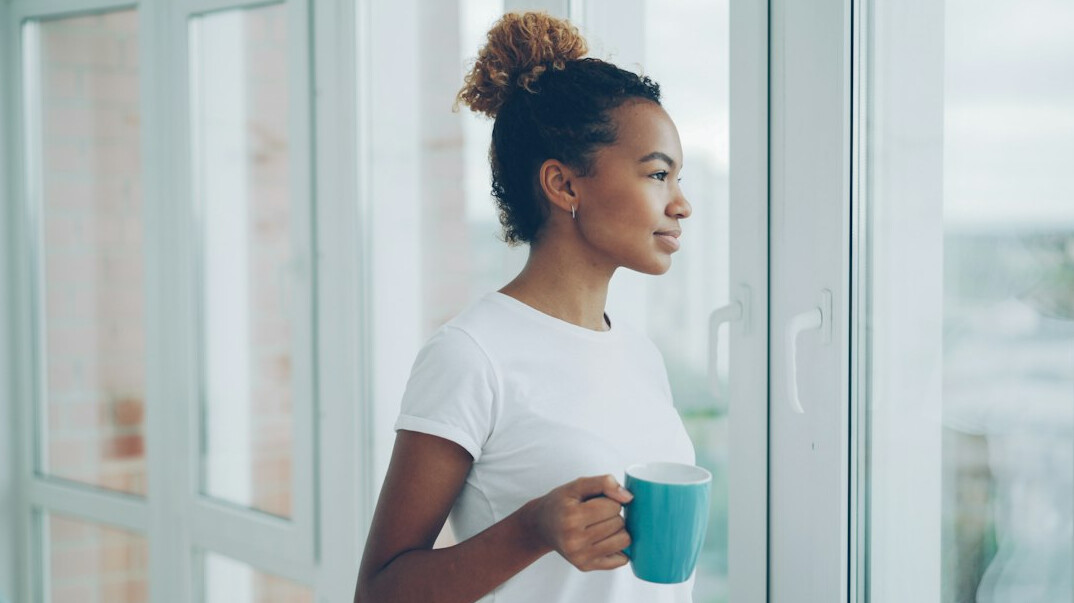 person drinking coffee at home